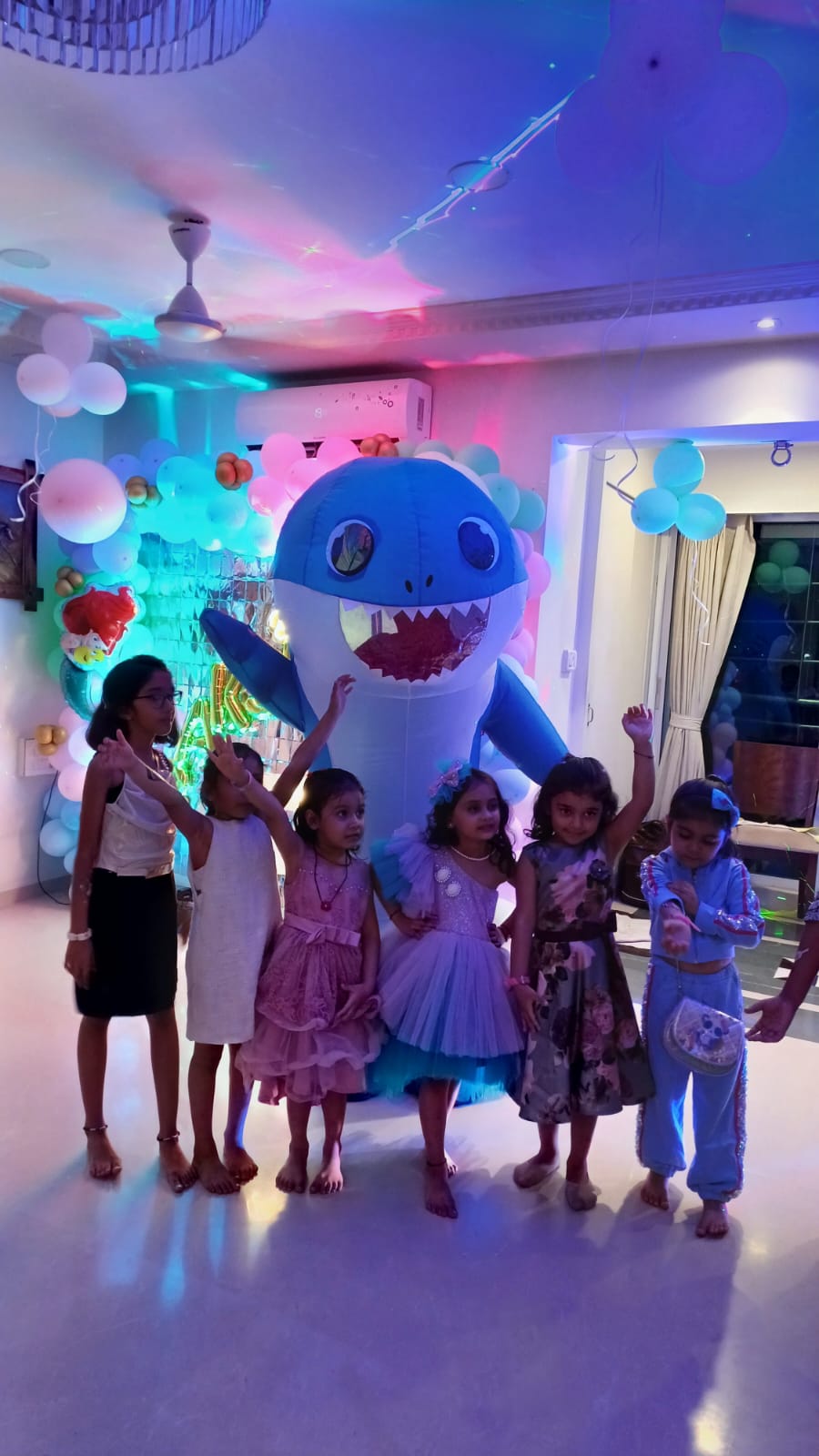 Child enjoying the Baby Shark mascot at a Toywala event